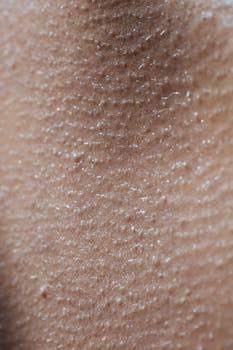 Detailed macro shot of human skin surface showing goosebumps and natural texture.