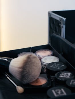 Close-up of makeup tools and accessories in a case, perfect for beauty and fashion content.