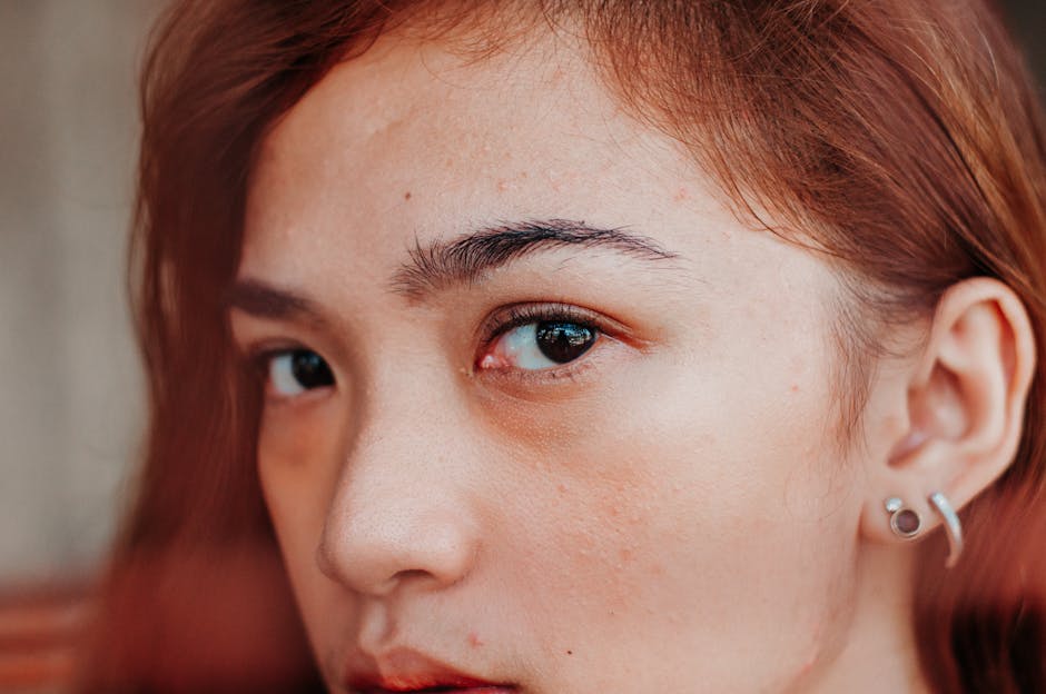 Intimate close-up portrait of a woman with red hair showcasing natural beauty.